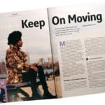 Pcture of magazine spread with a young dark skinned woman and words "Keep on Moving".